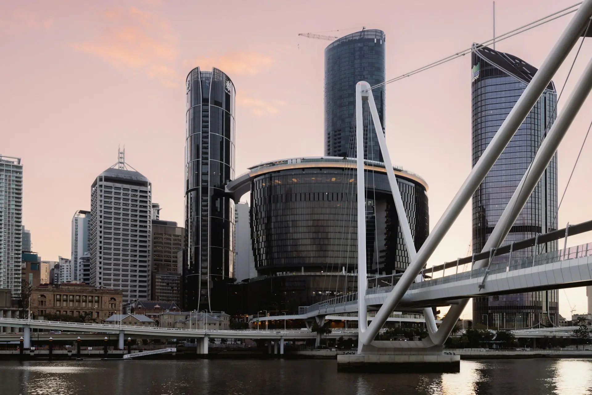 Brisbane city skyline across the Brisbane River at sunrise